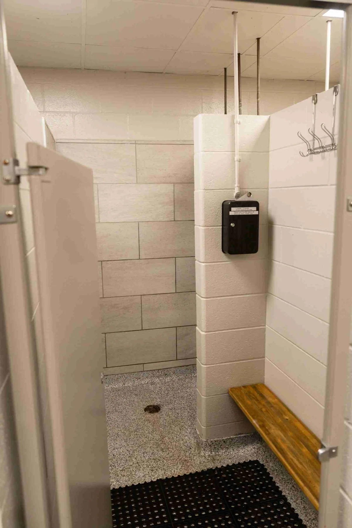 Clean tiled shower room inside the campground bathhouse