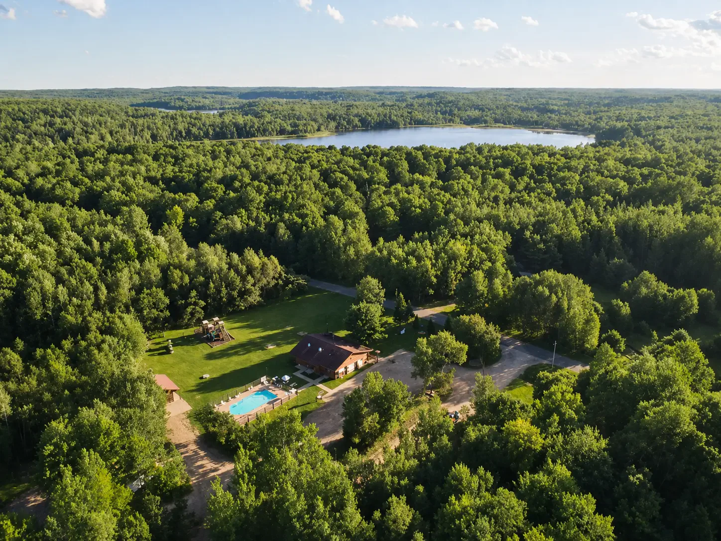 Aerial view of Heaven’s Up North Campground surrounded by Northwoods forest near Lakewood, Wisconsin.